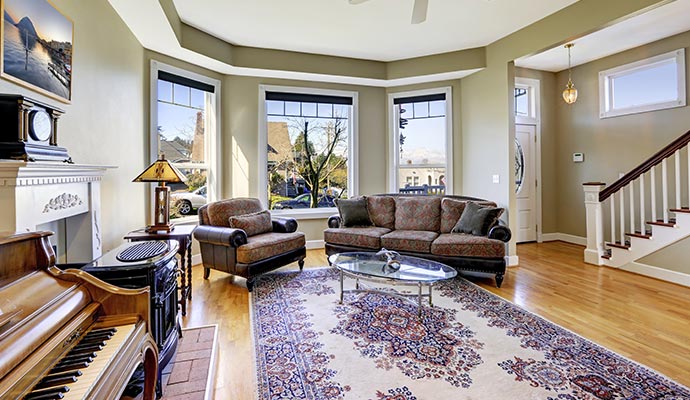 Antique rug on the floor of a living room