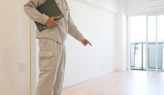 Professionl inspecting room floor
