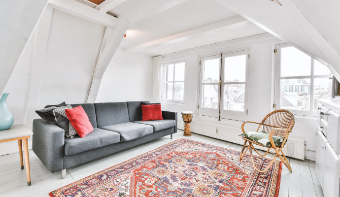 a well furnished room with beautiful rug