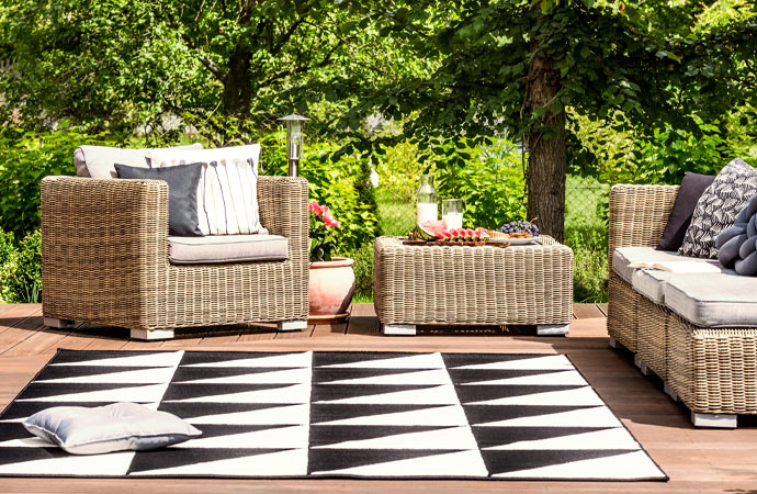 A black and white rug placed outdoors.