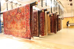 Area Rugs drying on Suspended Racks