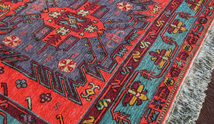 clean and design multicolored turkish rug on wood floor