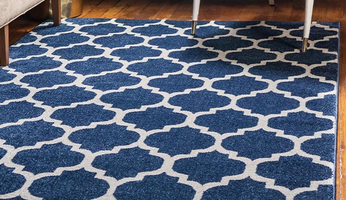 Clean area rug placed on a wooden floor