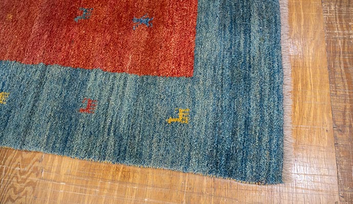 clean rug on wood floor rug closeup orange blue