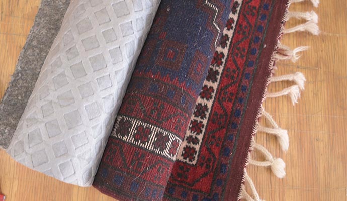 Rolled rug with padding