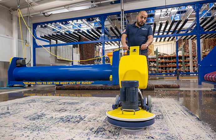 An expert uses a vacuum cleaner
