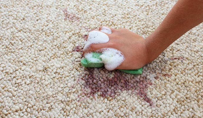 female hand clean the tug with a sponge and detergent