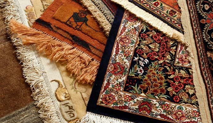 Collection of fine hand-knotted silk rugs with delicate fringes