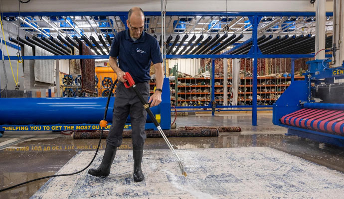 Man washing the rug