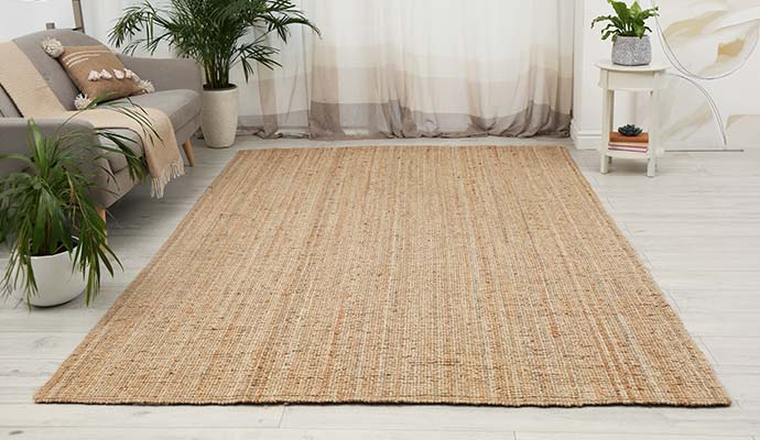 Natural woven jute area rug in a modern living room