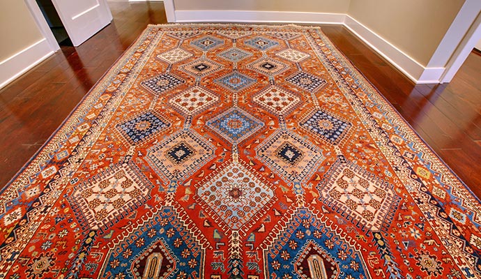 Orange geometric patterned antique rug