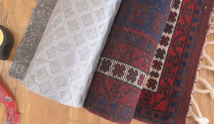 Rolled up rug and rug pad