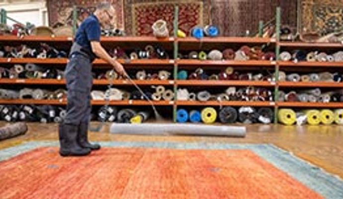 Rug protection being applied