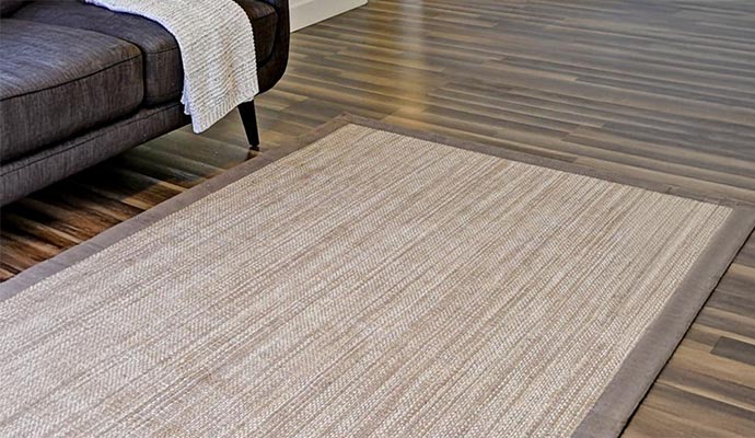 Binded area rug on floor