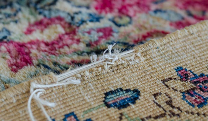 Frayed rug edge