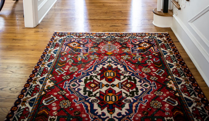 Clean Portuguese rug placed on a wooden floor