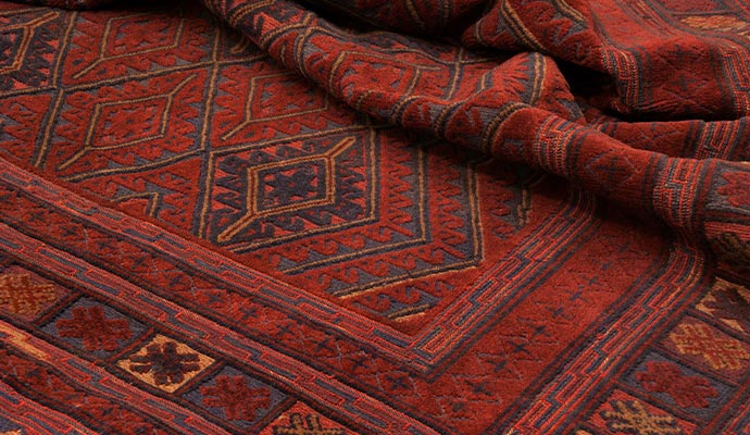 Dark red tribal Persian rug
