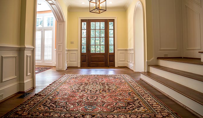 Large persian rug in home foyer
