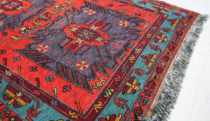 Vibrant red and teal tribal rug