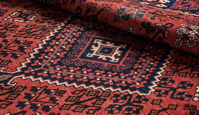 Red persian rug close up