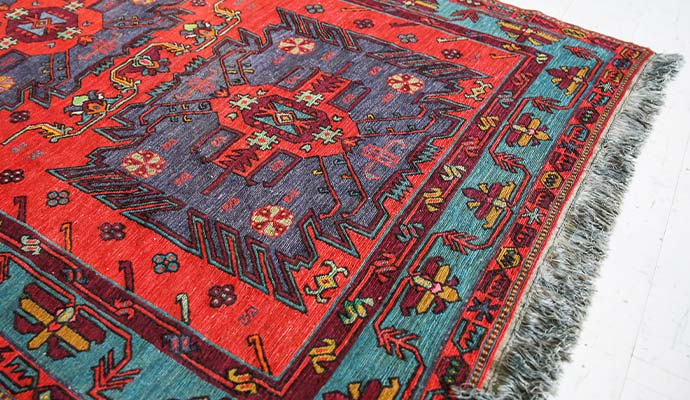 Traditional Turkish area rug with vibrant colors and geometric patterns